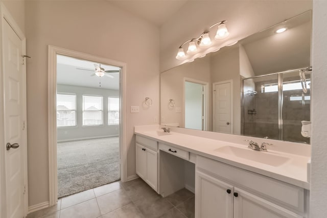 bathroom featuring ceiling fan, tile patterned flooring, vanity, and an enclosed shower