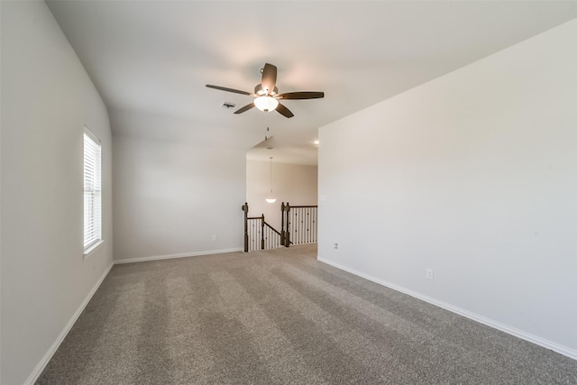 carpeted empty room with ceiling fan