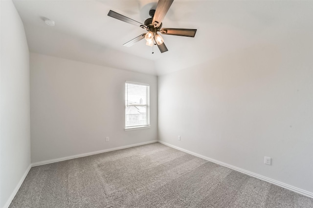 empty room featuring carpet flooring, ceiling fan, and lofted ceiling