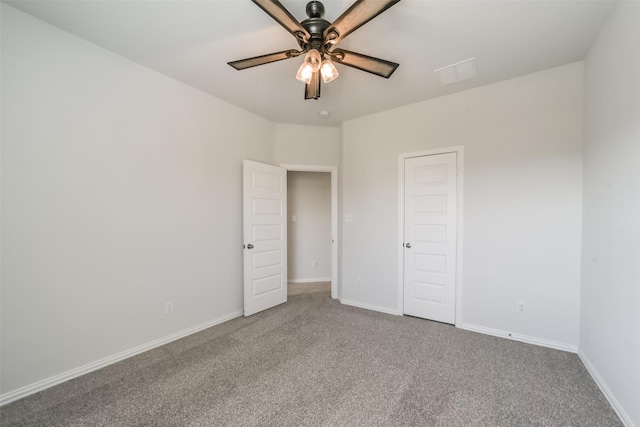 unfurnished bedroom featuring ceiling fan and carpet floors