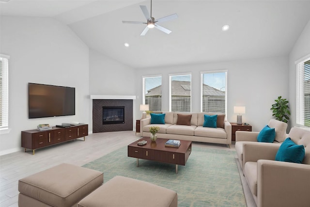 344 Spruce Oak Ln, Waller, TX 77484 - living area with vaulted ceiling, a ceiling fan, wood finished floors, a glass covered fireplace, and recessed lighting