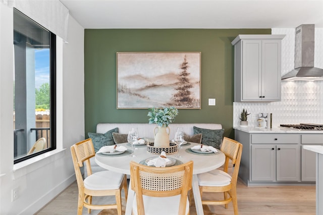 dining room with breakfast area and light hardwood / wood-style flooring