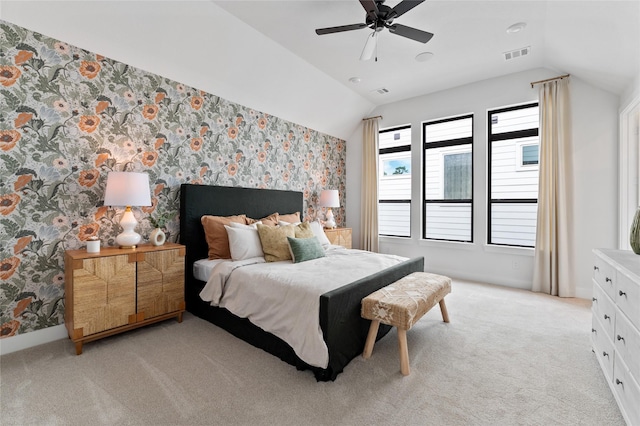 carpeted bedroom with ceiling fan and lofted ceiling