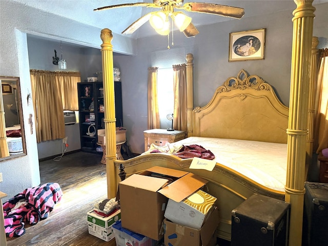 bedroom featuring ceiling fan and dark hardwood / wood-style floors