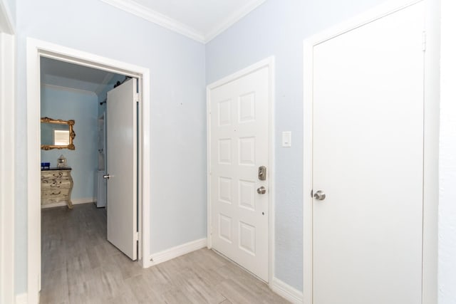 interior space featuring crown molding and light hardwood / wood-style flooring