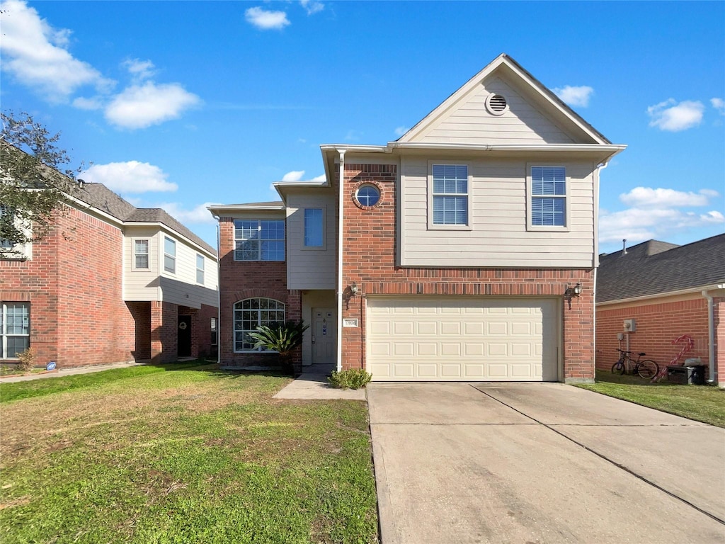 front facade featuring a front yard and a garage