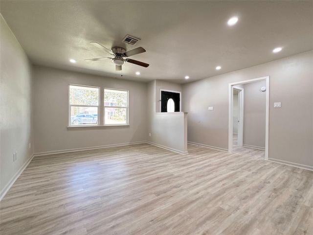 spare room with light hardwood / wood-style flooring and ceiling fan