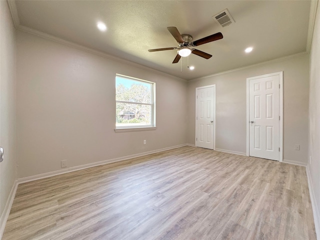 unfurnished bedroom with ceiling fan, ornamental molding, and light wood-type flooring