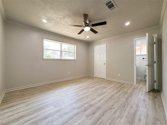 unfurnished bedroom featuring ceiling fan, light hardwood / wood-style flooring, a textured ceiling, and ornamental molding