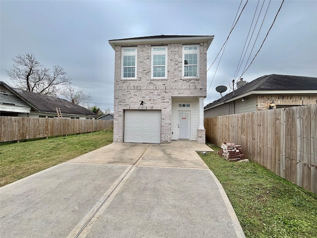 view of front facade featuring a garage and a front lawn