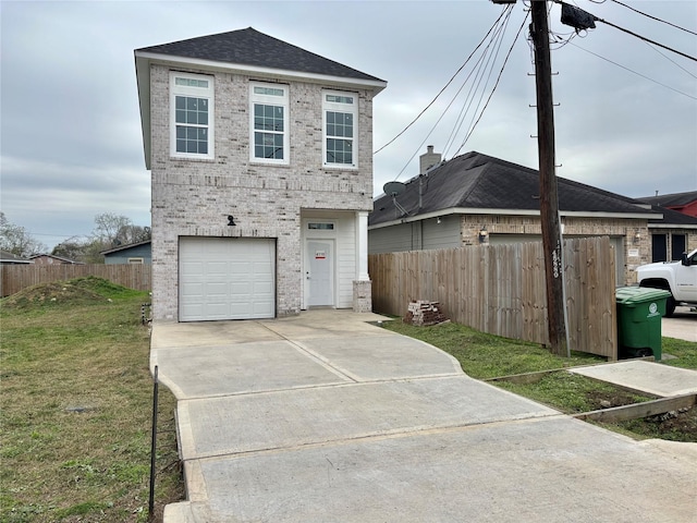 view of front facade featuring a front yard and a garage