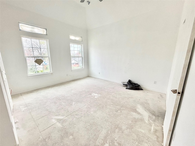 empty room featuring a towering ceiling