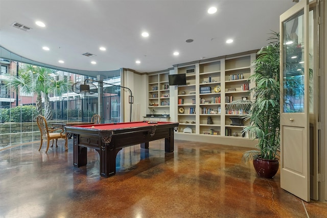 game room with pool table, built in features, and floor to ceiling windows