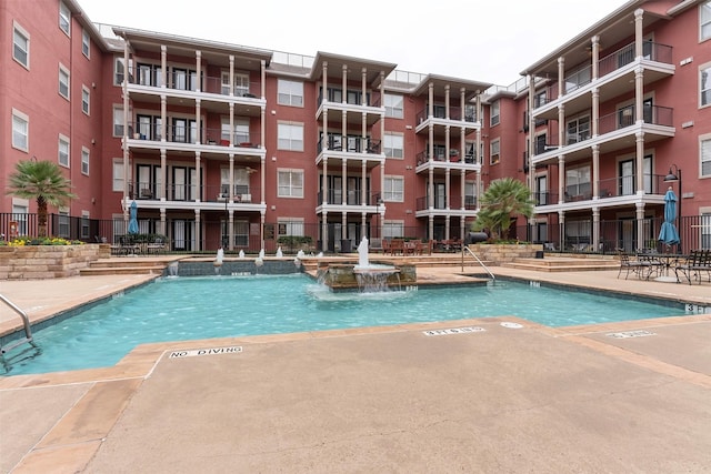 view of pool featuring pool water feature