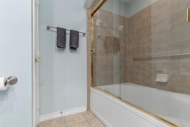 bathroom with tile patterned flooring and combined bath / shower with glass door