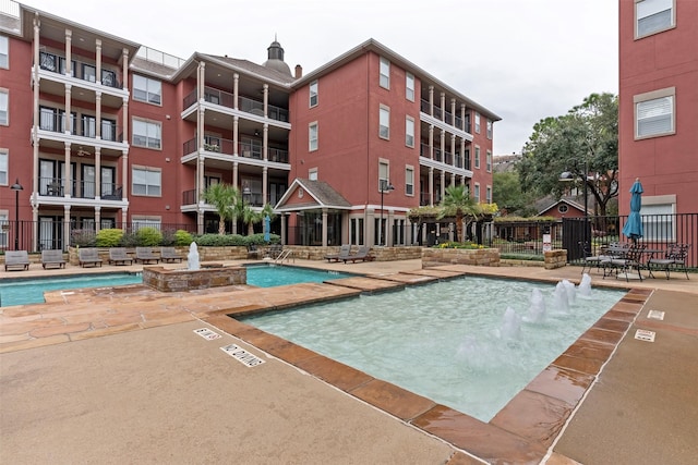 view of pool featuring pool water feature