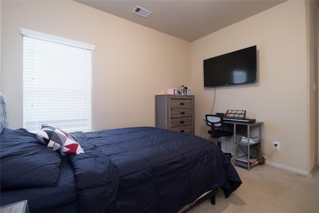 bedroom with light colored carpet