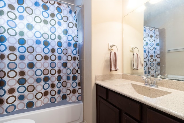 bathroom featuring vanity and shower / bath combo with shower curtain