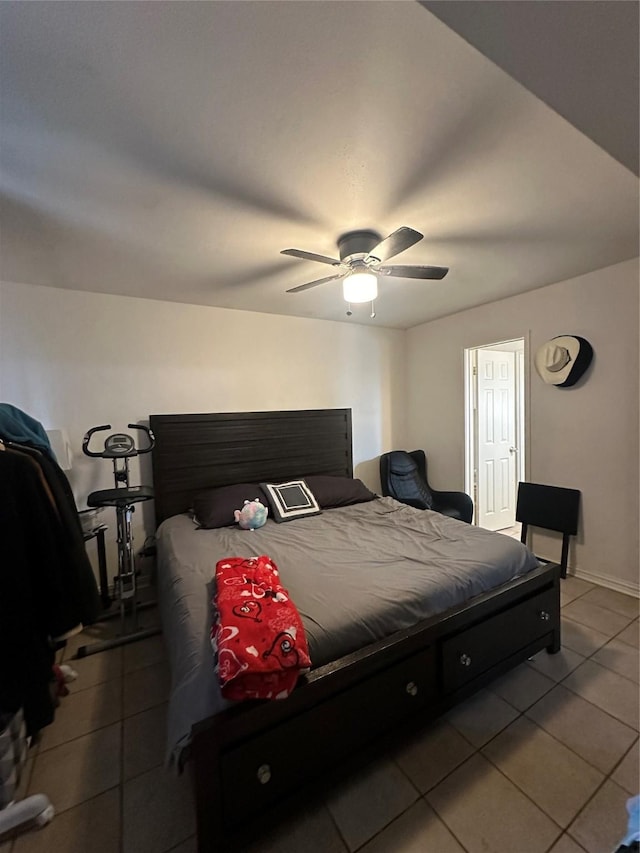 bedroom with tile patterned floors and ceiling fan