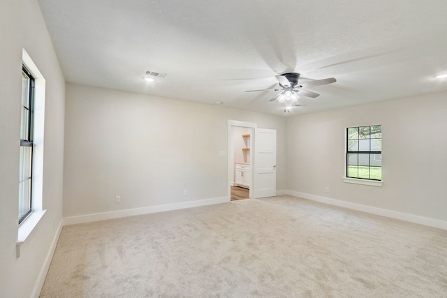 carpeted empty room with ceiling fan