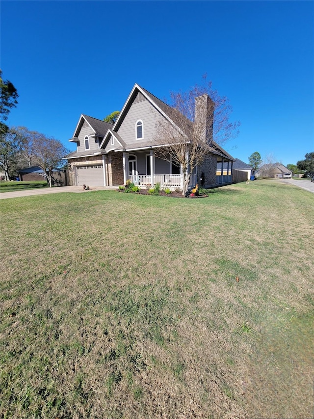 view of front of home with covered porch and a front yard