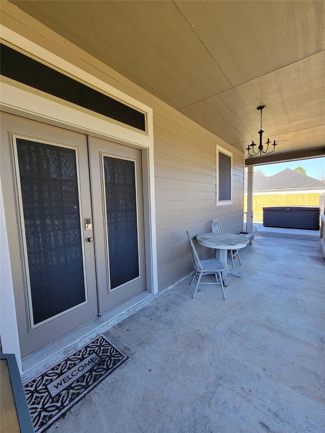 view of patio / terrace with a hot tub