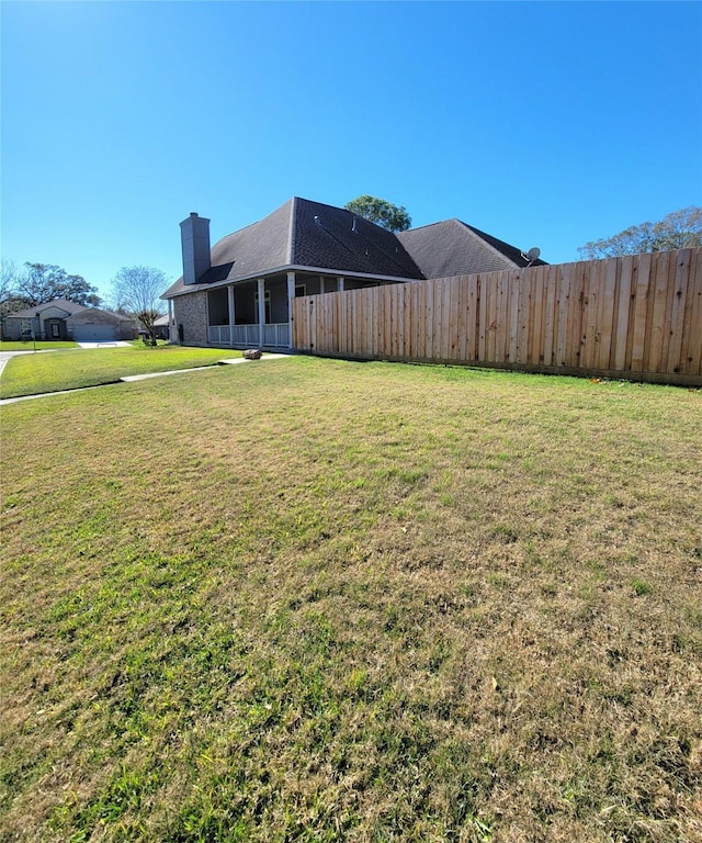 view of yard featuring fence