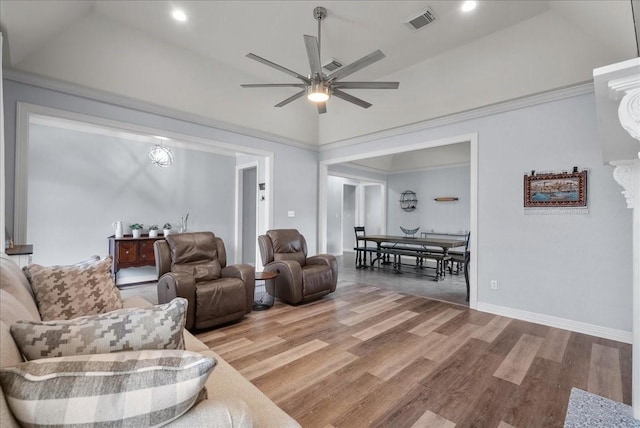 living area featuring high vaulted ceiling, a ceiling fan, visible vents, and wood finished floors