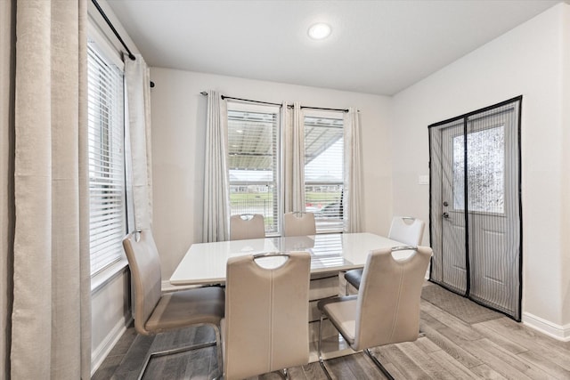 dining space featuring light wood-type flooring