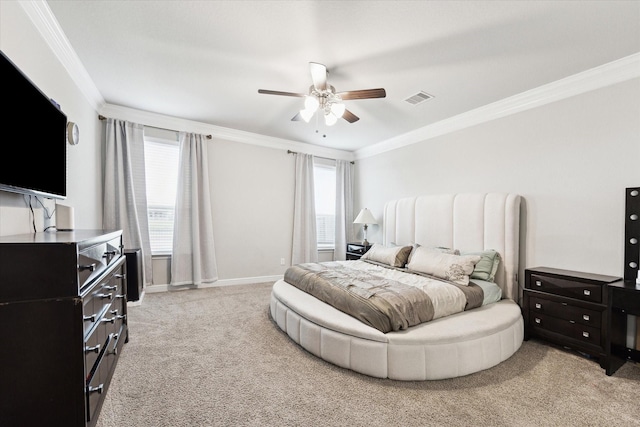 carpeted bedroom featuring ceiling fan and ornamental molding