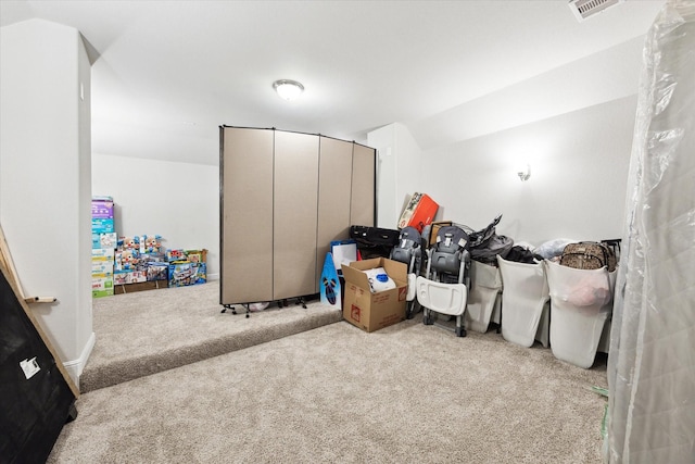 carpeted bedroom featuring lofted ceiling