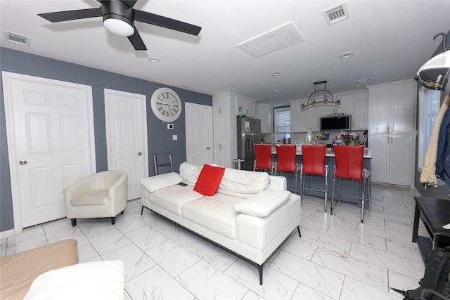 living room featuring ceiling fan