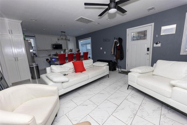 living room with ceiling fan