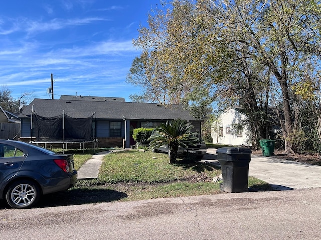 single story home with a trampoline