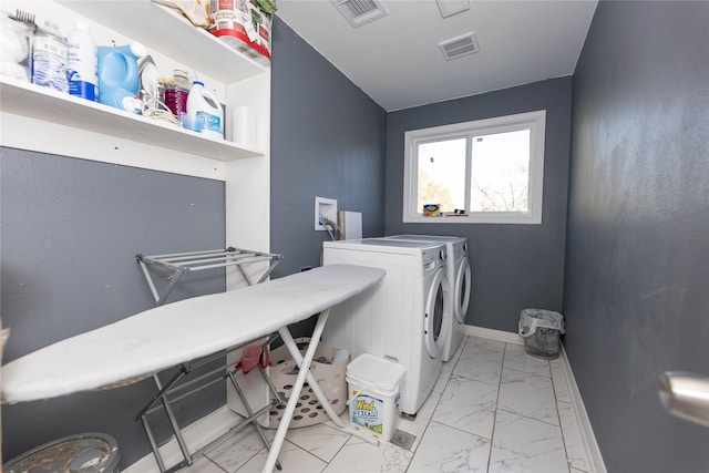 laundry area with washer and dryer