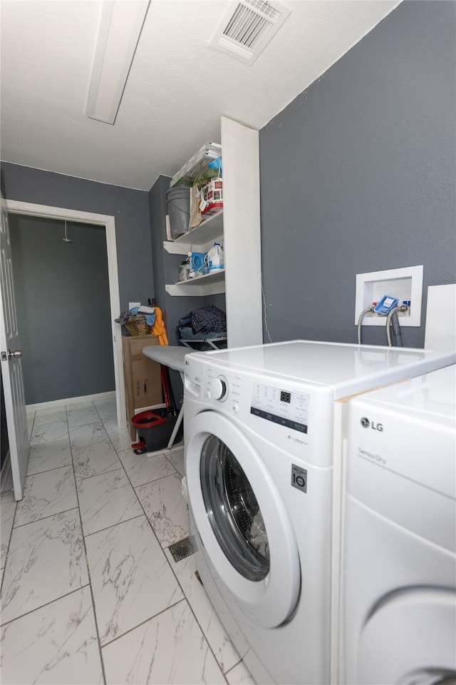 laundry area featuring washer and clothes dryer