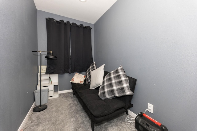 living area with carpet floors and lofted ceiling