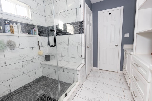 bathroom with a shower with door