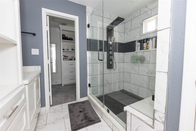 bathroom featuring vanity and walk in shower