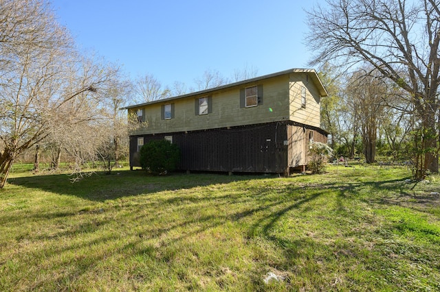 view of home's exterior featuring a yard