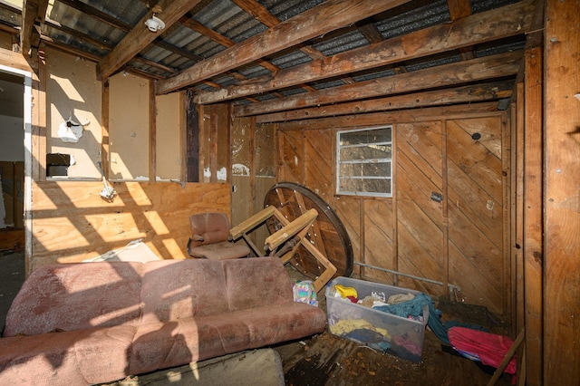 miscellaneous room with wood walls