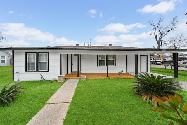 single story home featuring a front yard and a carport