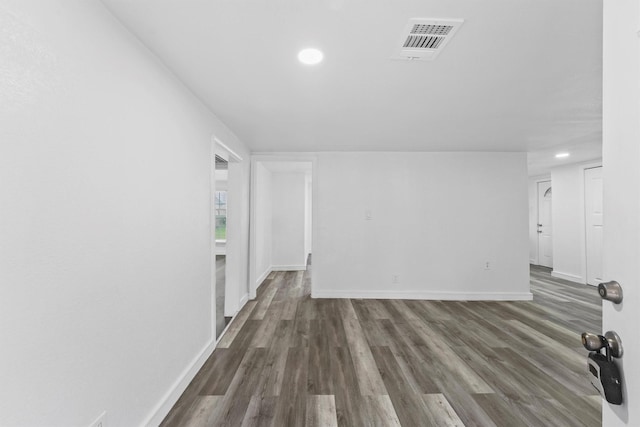 unfurnished living room featuring dark hardwood / wood-style floors