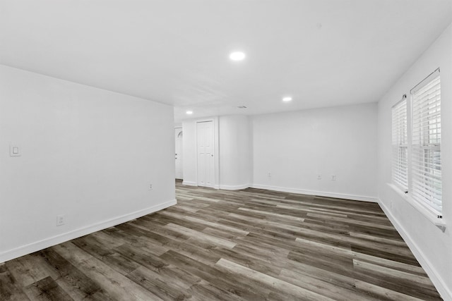 empty room with dark hardwood / wood-style floors