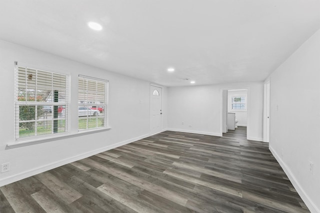 unfurnished room featuring dark hardwood / wood-style floors