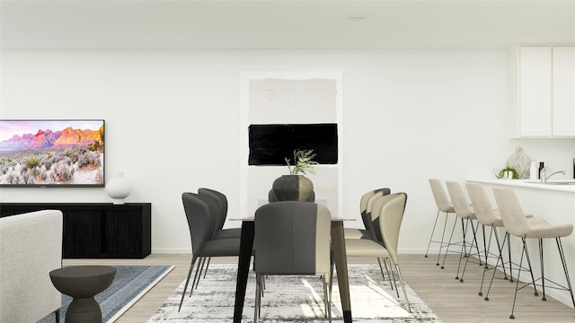 dining area with light hardwood / wood-style flooring and sink