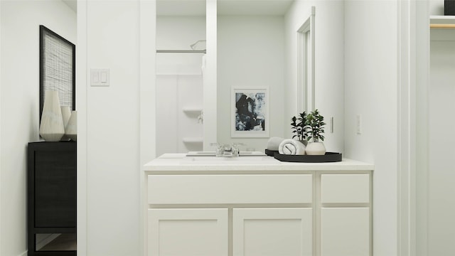 bathroom with a shower with shower curtain and vanity