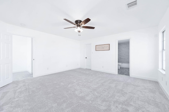 carpeted empty room with ceiling fan