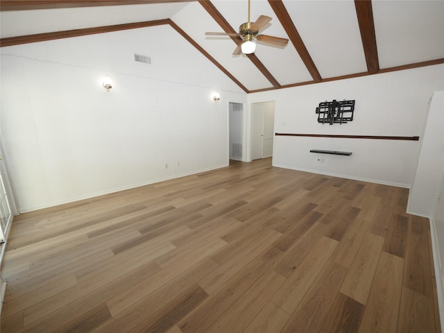 unfurnished living room with hardwood / wood-style flooring, vaulted ceiling, and ceiling fan