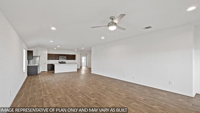 unfurnished living room with ceiling fan and wood-type flooring